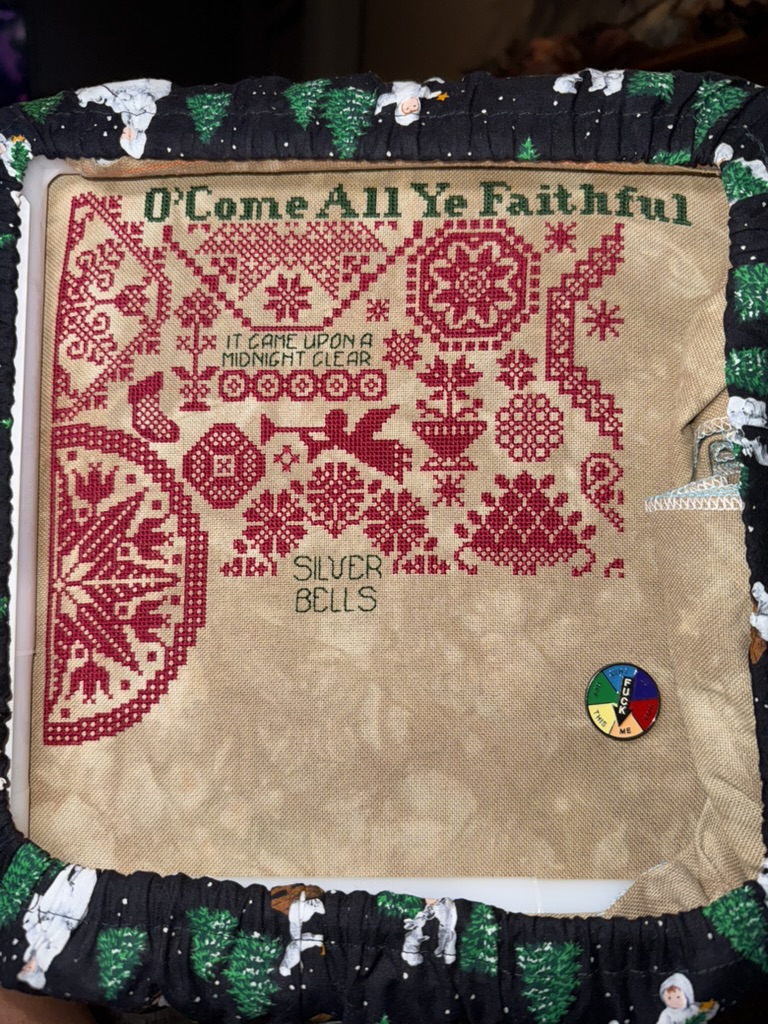 Anne&rsquo;s counted cross-stitch of Quaker Christmas II by ByGone Stitches, in progress on its frame